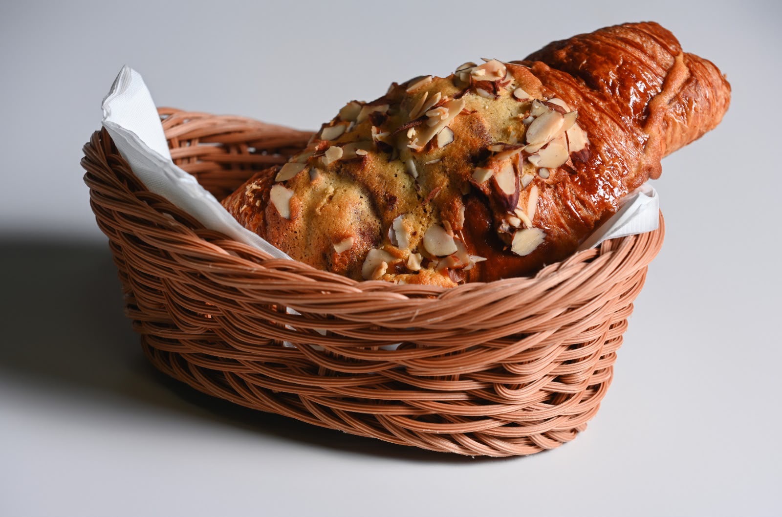 Almond croissant topped with almond cream and toasted flaked almonds